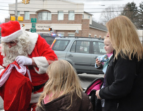 Santa stops to see sisters Madeline and Claire Meyler, ages 5, and 19 months.