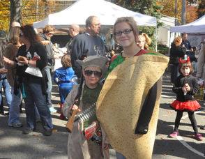Joshua Schneider the Zombie Hunter, age 6, with Aubrey McCarrick, age 13, in a taco costume.