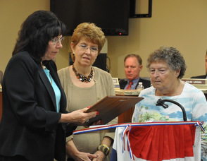 Hopatcong Woman's Club Members, Marlene Colabella, and Ellen Buongiorno, receive the proclamation from Hopatcong Mayor Sylvia Petillo.