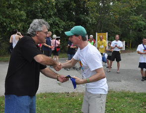 Tom Sweeney accepts his ribbon from Richard Bunce.