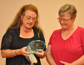 Mayor Sandra Diglio presents Margaret McCabe with a plaque for her service to the Planning Board.