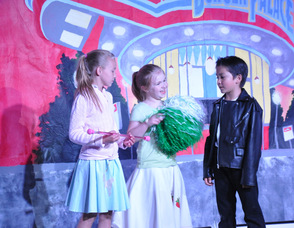 Sandy, Patty Simcox, and Danny in a scene together.