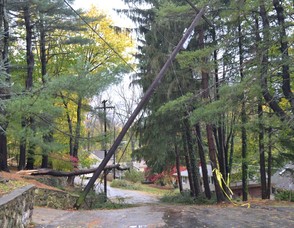Hilltop Trail is not passable as snapped utility poles with live wires and a fallen tree block any safe passage.  More than 30 Roads in Sparta Township are in the similar shape. (Sparta Township Police Photo).