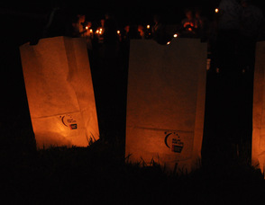 Luminarias glow along the pathway.