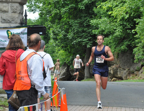 Third place winner Jeff Staple crosses the finish line.