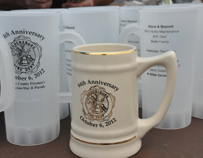 Ceramic and plastic mugs commemorating the event.