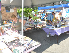 People browse the Silent Auction items.