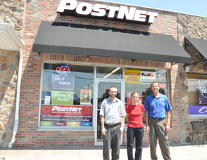 Steve Geary, Wendy Asplund, and Dan Thomas in front of PostNet Store 129.