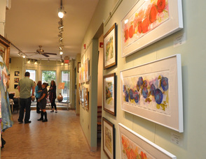 Fresh produce and farm scenes line the walls of TraillWorks for the "FRESH" Exhibit.