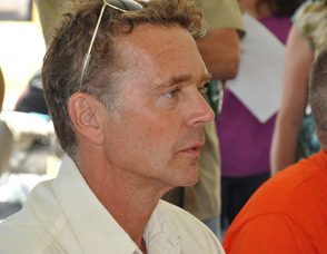 John Schneider observes the Daisy Dukes during the contest.