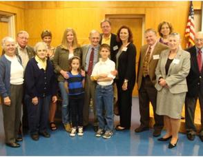 Bob Czaja, Center, surrounded by Friends of the Library members, family and library staff