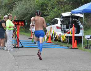 Stefan Alvinsson,the first to complete the 10K, crosses the finish line.