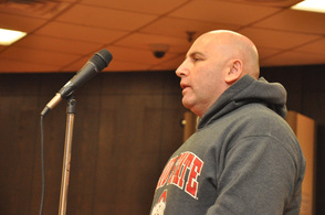 Anwar Qarmout addresses the council.