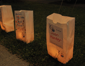 Names of survivors light the path.