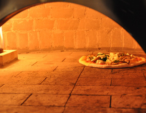 A pizza bakes in Kings Food Market in Livingston.