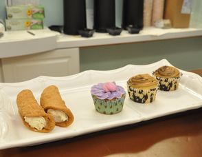 Baked goods lined up on a tray.