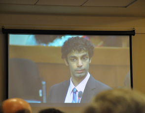 Dharun Ravi as shown onscreen from a conference room outside the courtroom.