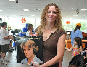 Evelyn Francisco with her John Schneider album.