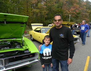 Bill Mann with his son and his Dodge Charger