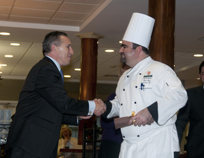 Crane’s Mill Executive Director Craig Karczmer congratulates Executive Chef Peter Day on the impressive reinvention of the facility’s dining venues at the ribbon-cutting ceremony held in November. (l. to r.)