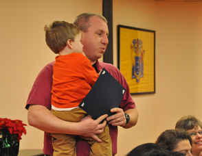 Coach John Flanagan recognizes the team.