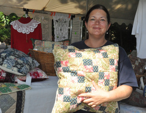 Wendy Van Dame of Mountain Lakes, NJ, with some of her quilted works.