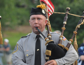 Members of the Police Pipes and Drums of Morris performed for the students.