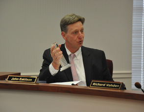 John Eskilson holds up an award the county received for excellence in cloud computing.