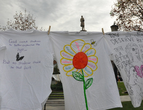 A variety of t-shirts designed by victims to raise awareness.