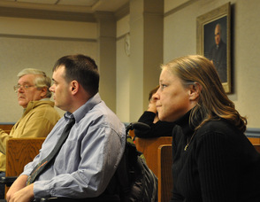 Scott Harris and Kathi Unangst wait in the courtroom for the proceedings to begin.