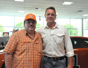 Joe Prudente, a fan, poses with John Schneider.