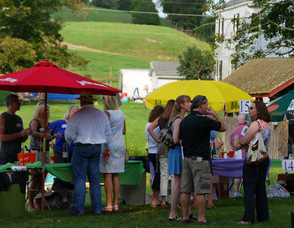 Participants taste wines offered at the event.
