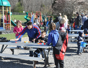 Andover Township children sort through their eggs after the hunt, to take home candies and other treasures.