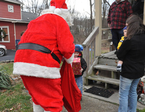 Santa makes a stop to the home of Ryan and Jacob Garrigan, ages 3 and 1.
