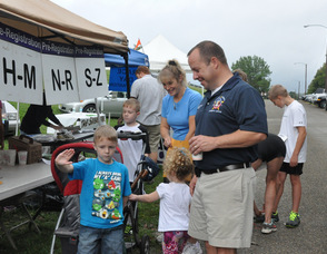 Sheriff Michael Strada with his wife, Kim, and their children before the race.