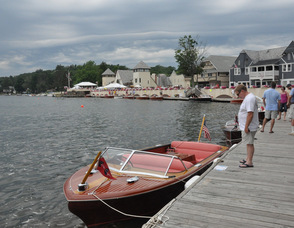 Spectators enjoy boats along Lake Mohawk.