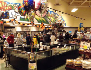 Residents get coffee at Shoprite, which is open
