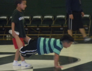 kids doing the wheelbarrow race