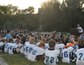 Players listen to Chris Quinn.