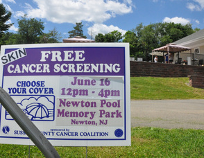 Sign welcoming residents to the skin cancer screening at Memory Park Pool.