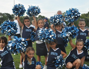 Kindergarten age cheerleaders for the white flag team.
