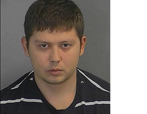 Alexy Razumov, was charged with helping his brother sell items to pawn shops stolen from murder victim Virginia "Suzy" Sommer.