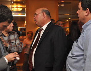 Chris Kelly speaks with supporters.