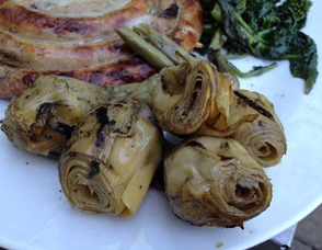chicken sausage pinwheel stuffed with mozzarella and herbs, with long stem artichokes