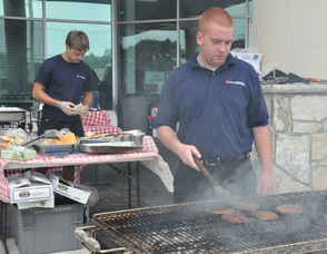 Mike Renge and Parker Gordon at the grills with The American BBQ Company.