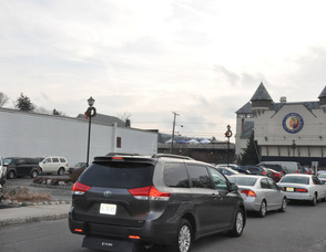 Cars pack the parking lot beneath the Lake Mohawk Country Club and Boardwalk.