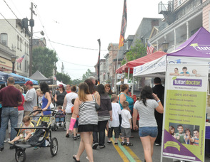 Visitors to Spring Street enjoy grilled items, and items sold by vendors.