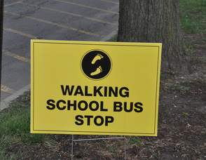 Sign for the Walking School Bus along Trinity Street.