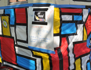 A take on the Partridge Family Bus, encourages "Positivity Petals" with inspiring messages.