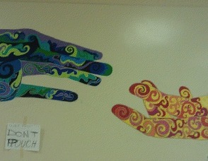 A painting by Maggie Fisher, who was inspired to study art. She helped to paint, and add her handprints to the "HOPE" Mural.